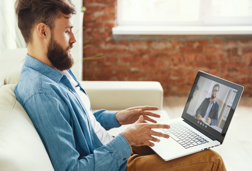 Man speaking with online financial counselor